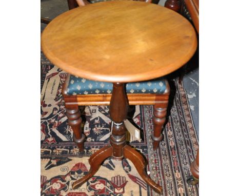 A Victorian mahogany circular wine table on turned pillar and cabriole tripod