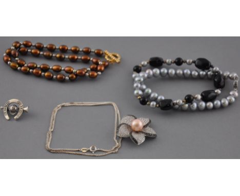 Two freshwater pearl necklaces together with a silver riding brooch, and a silver flower pendant and chain