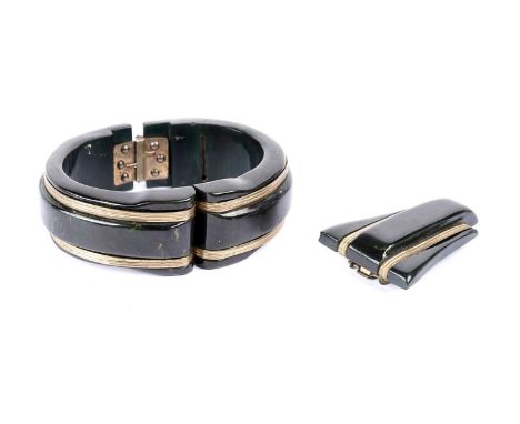 A 1930s Art Deco Streamline Moderne bangle and dress clip set, each of dark green lucite, in the style of spinach jade, with 