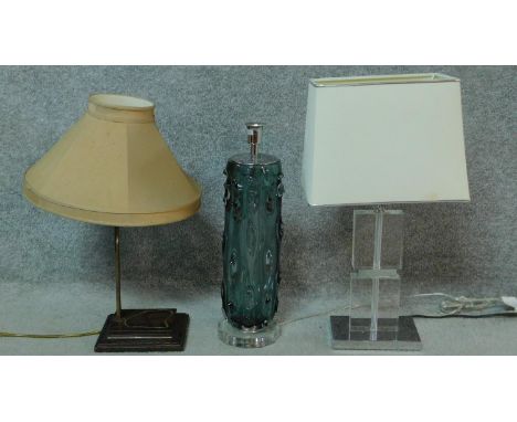 A trio of three contemporary lights one with a blown glass blue grey tree trunk form base, one with clear perspex block and c