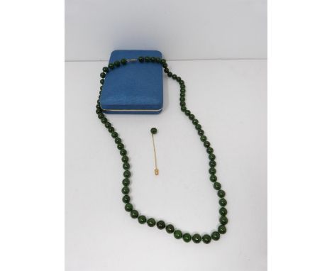 A nephrite necklace with a 10 carat gold clasp. Comprises of 72 round polished nephrite beads, all individually knotted. Each