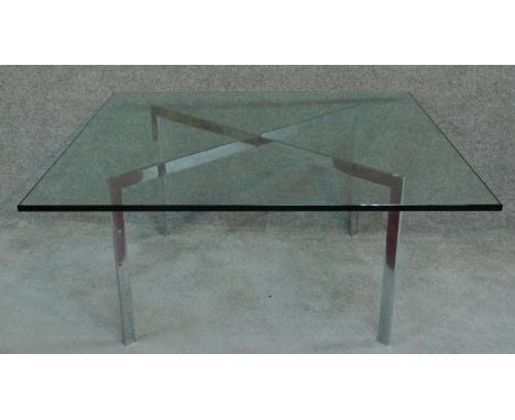 A contemporary square plate glass topped table on chrome base. H.46 W.100 D.100cm 