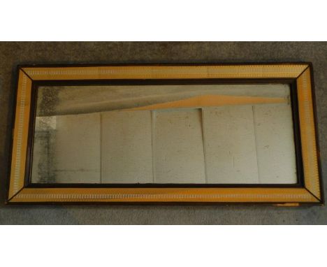 A 19th Century decorative framed mirror with repeating geometric pattern and gilt highlighted glaze to the edges. original pl