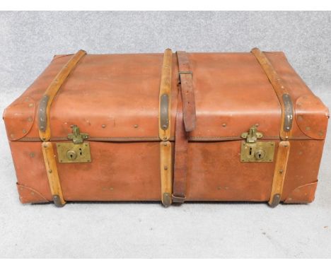 A vintage leather and wood steamer trunk. H.34 W.84 D.54cm 