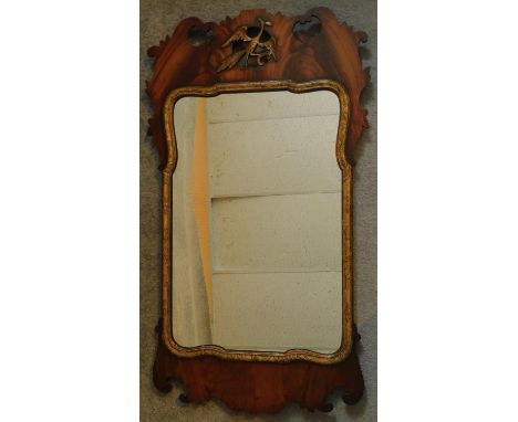 A Georgian mahogany and carved gilt fret carved wall mirror with original plate. 94x52cm 