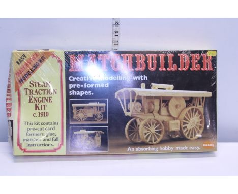 A sealed and boxed wooden model kit of a steam engine 