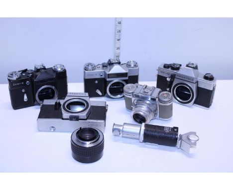 A job lot of assorted vintage camera bodies and accessories 