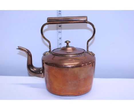A vintage copper and brass kettle 