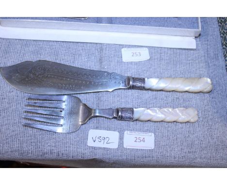 A pair of hallmarked silver mounted fish slice and fork with MOP handles 