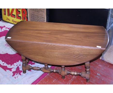 A vintage mid-century Ercol drop leaf coffee table. Shipping unavailable 