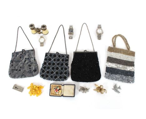A box containing various small vintage style bags; a pair of opera glasses; brooches; watches; cigar cutter etc.