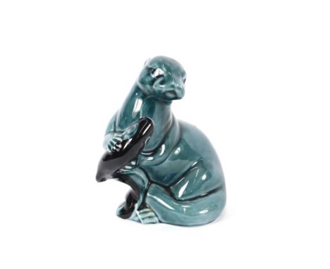 A Poole pottery figure of an otter and fish, 12cm high