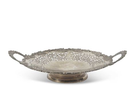 George V large silver twin handled dish of circular form, the edge applied with a grape and vine leaf pattern, the twin cast 