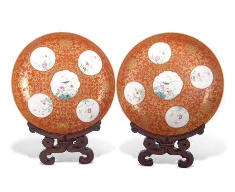 Two 19th Century Chinese porcelain coral ground bowls with gilt scroll decoration, each bowl having five reserves with polych