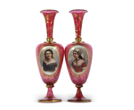 A pair of 19th Century continental ruby glass vases, finely painted with panels of young girls within gilt scroll borders, 33