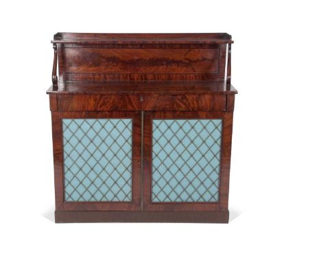 An early 19th Century mahogany chiffonier with single galleried shelf, raised on scroll supports over a base with single frie