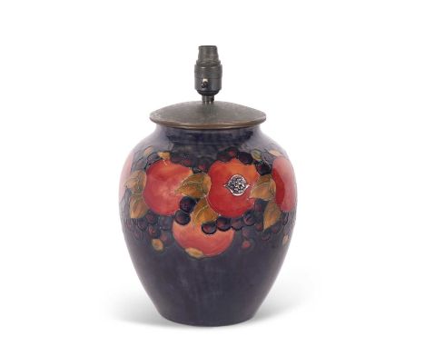 A large Moorcroft pomegranate lamp base, the top with metal cover, the lamp base 30cm high with factory marks and Moorcroft p