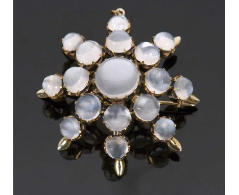 A moonstone 'star' brooch, the star shape comprised of graduated round moonstone cabochons, all claw mounted in unmarked yell
