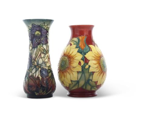 Two Moorcroft vases with modern designs, the first of baluster shape with sunflower design, and further vase with tube lined 