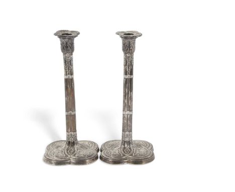 Pair of Art Nouveau silver candlesticks of quatrefoil form having detachable nozels, shaped ancanthus leaf capitals, clustere