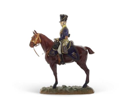 An impressive Dresden porcelain model of Cavalry soldier on horseback, the base marked in blue, 12th Light Dragoons, Reviero 