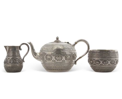 A cased Victorian three piece silver breakfast service, comprising teapot, milk jug and sugar basin of compressed baluster sh