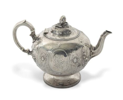 A Victorian silver teapot of globular bullet shaped onto a cast beaded circular spreading foot, the body embossed, chased and