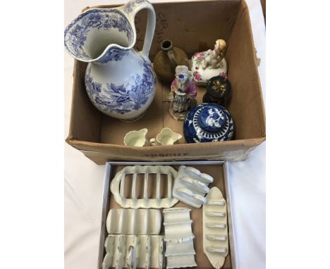 Two boxes of vintage ceramics. To include a collection of toast racks, an antique ceramic figurine and a blue and white ginge