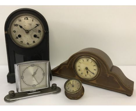Four vintage clocks. An Art Deco 8 day chrome finish desk clock,  a wooden case Napoleons hat mantel clock, a wooden cased ma