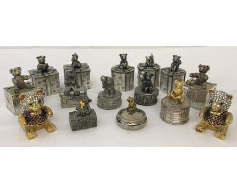 A small collection of metal teddy bear trinket boxes.
