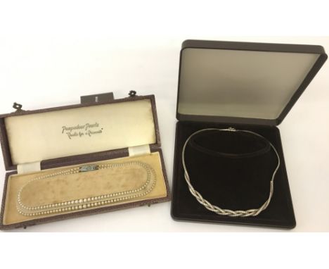 2 vintage boxed necklaces. A set of faux Pompadour Pearls with decorative clasps and a 925 silver necklace with plaited desig