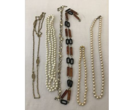 A collection of 6 vintage costume jewellery necklaces to include 4 with faux pearls. To include Monet and 1928.