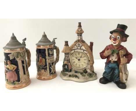 A pair of vintage small West German bier steins.Together with a David Winter "Little Cottage" clock and a clown ornament.
