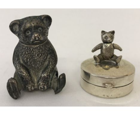 A small silver teddy bear trinket box. Bear has moveable head and arms. Together with a hallmarked Birmingham 1934 silver ted