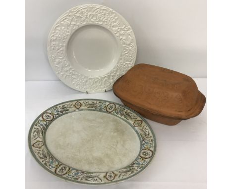 A vintage large meat plate with bird decoration to rim. Together with a terracotta romertopf baker and a modern Italian white