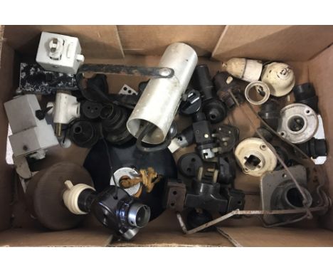 A box of vintage electrical lighting parts to include wall lights, plugs and sockets.