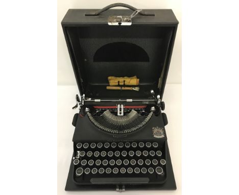 A vintage cased Imperial typewriter with original cleaning accessories.