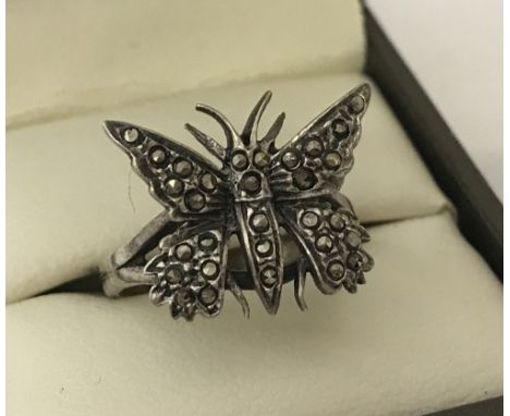 A vintage butterfly dress ring set with marcasite stones. Marked sterling inside band.