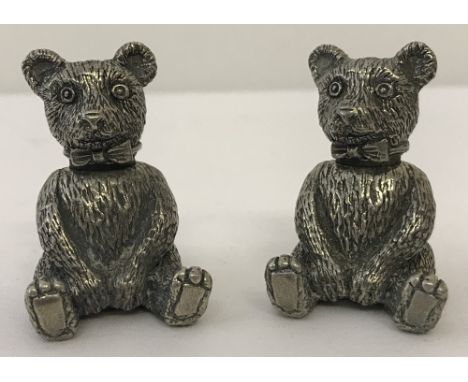 A vintage pewter teddy bear cruet set.