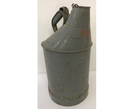 A vintage metal railway water can, painted grey and Marked BR.