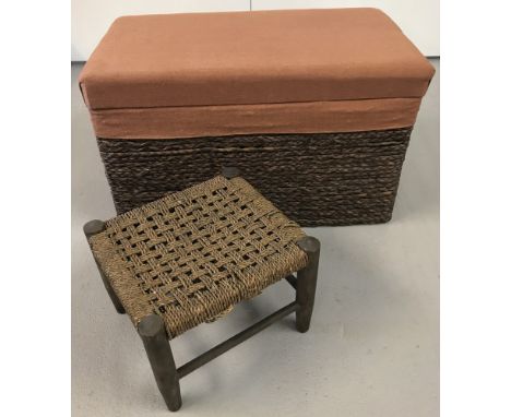 A plaited rush trunk with terracotta hessian lid and trim together with a small string topped stool.