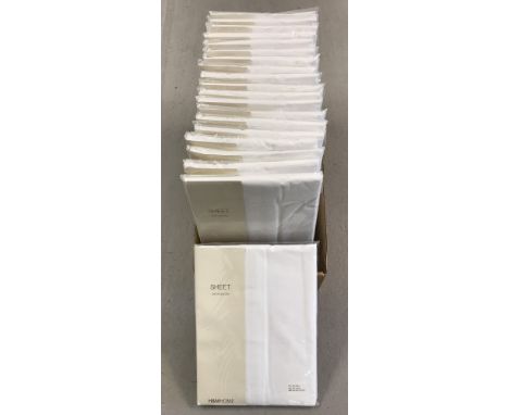 A box of 20 new, packaged and unopened white cotton double flat bed sheets. Made for H &amp; M Home.
