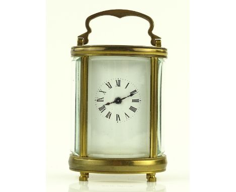 A modern French brass cased oval carriage clock, height 8.5cm.