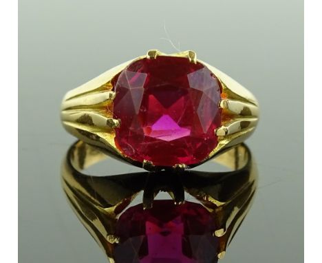 A gent's heavy synthetic ruby set gypsy ring, unmarked settings tests as 15ct gold, size P, 8.8g.