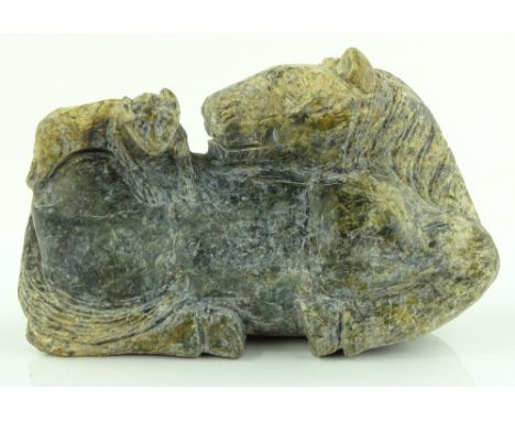 A Chinese jade reclining horse, length 17cm.