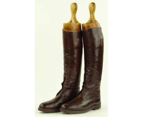 A pair of First War period brown leather Officer's riding boots with wooden trees.