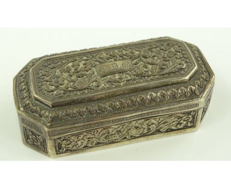 An Eastern white metal snuff box with relief floral decoration, length 10cm.