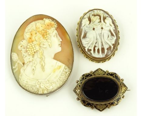 A Victorian unmarked gold onyx and enamel brooch, together with 2 relief carved Cameo brooches, (3).