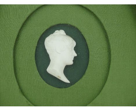 An early 19th century milk glass Cameo portrait of Princess Charlotte, by John Henning (Scottish), dated 1809, in oval gilt g