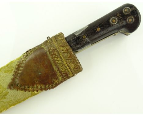 A Middle Eastern horn handled dagger, original brass mounted scabbard.